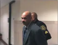  ?? CARL HESSLER JR. — DIGITAL FIRST MEDIA ?? Louis Henry Branch, 51, of Pottstown, is escorted from a Montgomery County courtroom after a jury convicted him of felony charges of rape of a child under 13.