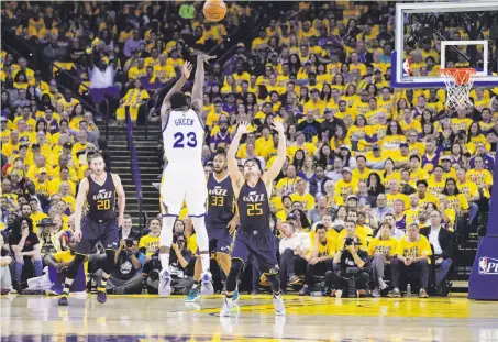  ?? Carlos Avila Gonzalez / The Chronicle ?? Draymond Green shoots a three-pointer in the first quarter of Game 2. He tied a season high with five made threes in the game.