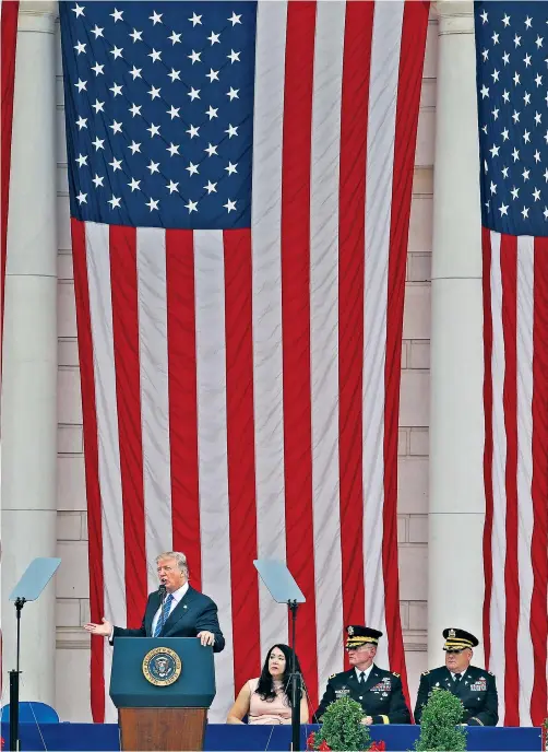  ??  ?? Donald Trump expressed his nation’s ‘boundless and undying’ gratitude yesterday to Americans who have fallen in battle, hailing as heroes those buried at Arlington National Cemetery. In his first Memorial Day speech, Mr Trump said: ‘Words cannot measure the depth of their devotion, the purity of their love or the totality of their courage.’