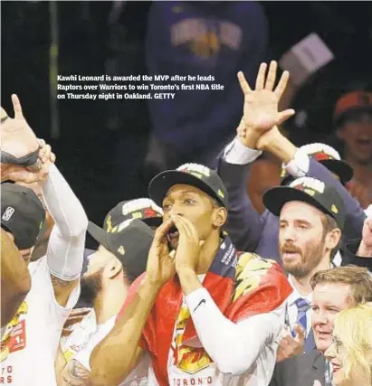  ??  ?? Kawhi Leonard is awarded the MVP after he leads Raptors over Warriors to win Toronto’s first NBA title on Thursday night in Oakland. GETTY