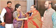  ?? PTI ?? Padmaja Venugopal, daughter of former Kerala CM Karunakara­n, with BJP chief J P Nadda and party leader Prakash Javadekar in New Delhi on Thursday.