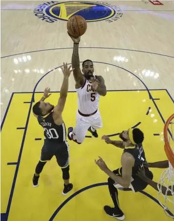  ?? (AP Photo/Marcio Jose Sanchez, Pool) ?? Cleveland Cavaliers, guard J.R. Smith (5) shoots against Golden State Warriors guard Stephen Curry (30) and center JaVale McGee during the first half of Game 2 of basketball’s NBA Finals in Oakland, Calif., Sunday, June 3, 2018.