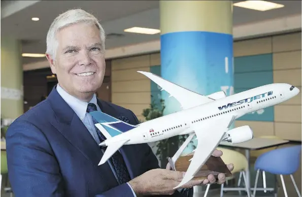  ?? LARRY MACDOUGAL/THE CANADIAN PRESS FILES ?? WestJet Airlines CEO Gregg Saretsky, seen with a model of the Boeing 787 Dreamliner, says the company prefers to hire Swoop pilots internally. WestJet is in talks with the pilots union, which says the firm has “not properly engaged” with it on Swoop.