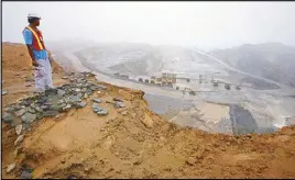  ??  ?? In this file photo, a worker looks at the Rapu Rapu open pit mine owned by the Australian firm Lafayette mining in Albay province, Feb. 5, 2007. REUTERS