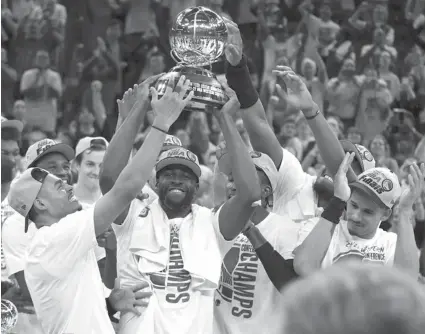  ?? / AP ?? WINNERS. Golden State Warriors celebrate with the conference trophy after defeating the Dallas Mavericks in Game 5 of the NBA basketball playoffs Western Conference finals in San Francisco, Thursday, May 26, 2022.