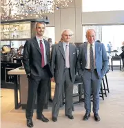  ?? REUTERS ?? President of Luigi Lavazza SpA Alberto Lavazza, centre, poses with vice presidents Marco, lelft, and Giuseppe Lavazza at the opening of Lavazza’s new flagship coffee store in Milan on Tuesday.