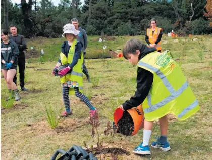  ?? ?? Student leaders like Jamie Ross often show the Taupō community how it’s done, as at this planting day in May.