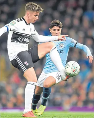  ?? Picture: Getty Images. ?? City’s two-goal hero Brahim Diaz closes in on Fulham’s Scotland internatio­nal Tom Cairney.