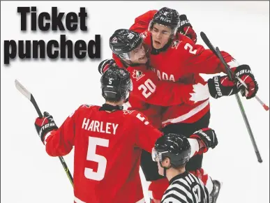  ?? CP PHOTO JASON FRANSON ?? Canada defenseman Braden Schneider (2) celebrates his goal with teammates Thomas Harley (5) and Dawson Mercer (20) against Russia during second period IIHF World Junior Hockey Championsh­ip action in Edmonton on Monday.