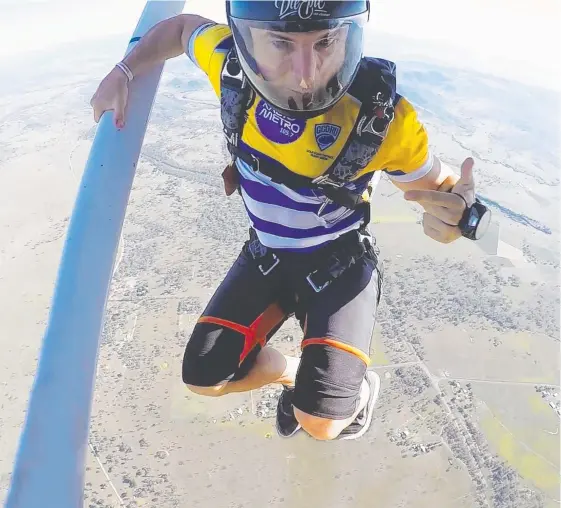  ?? Picture: TY FELS ?? Former Gold Coast Cyclones player Simon Backman helps put the extreme into Xtreme Rugby by jumping out of a plane at the launch.