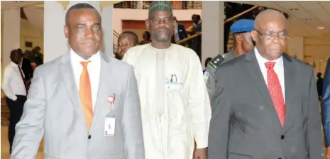  ?? Photo: NAN ?? Acting Chief Justice of Nigeria (CJN), Justice Walter Onnoghen (right) with the Senior Special Assistant to the President on National Assembly Matters (Senate), Sen Ita Enang (left), after the acting CJN’s appearance before the Senate for screening at...