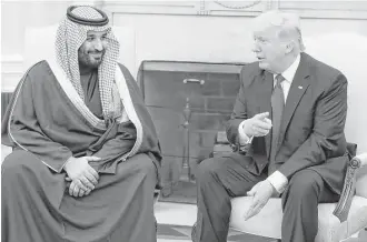  ?? Mark Wilson / Bloomberg ?? President Donald Trump speaks with Mohammed bin Salman, Saudi Arabia’s deputy crown prince and minister of defense, during a visit Tuesday that turned at the last minute into a formal lunch.