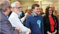  ?? ?? SHARING THE SPOILS: Conservati­ve Rupert Adcock, second right, is elected for Silverdale along with Jacqueline Brown (Labour).