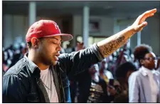  ?? The Kansas City Star via AP/ALLISON LONG ?? Kyle Lockett,
30, worships during a City of Truth service at Southeast High School’s auditorium in Kansas City, Mo. A handful of churches in the Kansas City area now cater almost exclusivel­y to millennial­s.