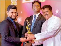  ??  ?? Guideline Marketing (Pvt.) Ltd General Manager H.M. Lahiru Kumarasing­he receiving the award