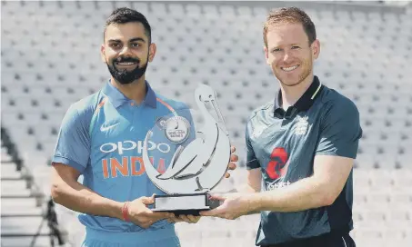  ??  ?? India captain Virat Kohli (left) and England captain Eoin Morgan hold the Royal London series trophy ahead of today’s opener at Trent Bridge.