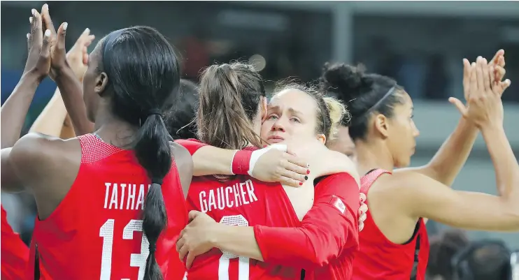  ?? — JEAN LEVAC ?? Team Canada players show their dejection and their appreciati­on for the fans after being eliminated by France in the women’s basketball quarter-finals Tuesday night.