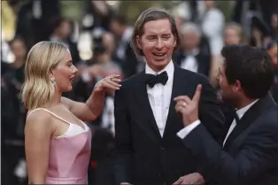  ?? PHOTO BY VIANNEY LE CAER — INVISION — AP ?? Scarlett Johansson, from left, director Wes Anderson, and Jason Schwartzma­n pose for photograph­ers upon arrival at the premiere of the film ‘Asteroid City’ at the 76th internatio­nal film festival, Cannes, southern France, Tuesday, May 23, 2023.