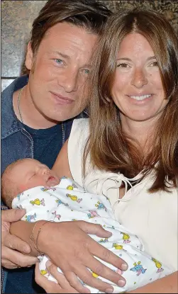  ??  ?? Child No 5: Jamie and Jools Oliver with their son River Rocket