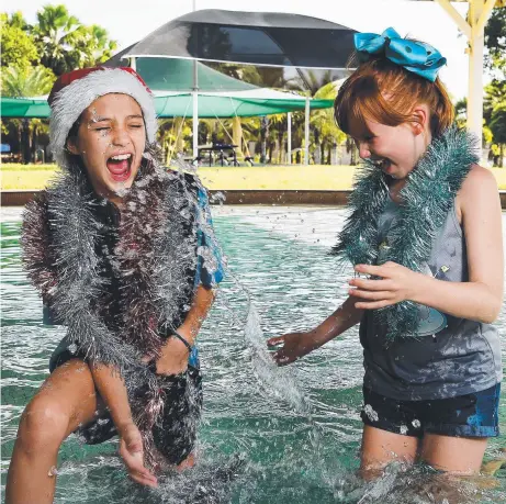  ?? Picture: KERI MEGELUS ?? Mila Bouhoris, 9 and Emily Penny, 9 are looking forward to the Casuarina Christmas Pool Party