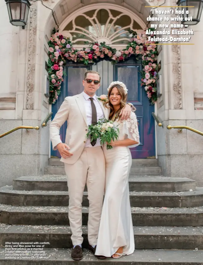  ??  ?? After being showered with confetti, Binky and Max pose for one of their first photos as a married couple, sharing their happiness exclusivel­y with hello! after their wedding at Chelsea Old Town Hall