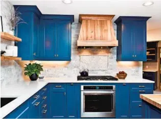  ?? GETTY IMAGES ?? Quartz kitchen countertop­s have become extremely popular. One reason is because they are easy to keep clean. Bolder colors are also making a comeback.