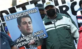  ?? Photograph: Erik Pendzich/Rex/Shuttersto­ck ?? A protester holds a sign recommendi­ng that President Juan Orlando Hernández be extradited.
