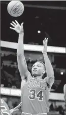  ??  ?? Wendell Carter Jr. shoots a jumper in the first half against the Pistons. Carter finished with eight points and two rebounds.