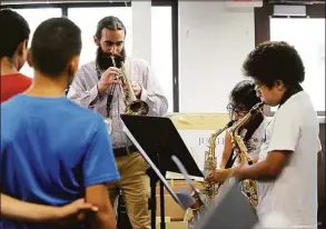  ?? Carol Kaliff / Hearst Connecticu­t Media file photo ?? The fifth-grade band at Park Avenue School in Danbury, under the direction of music teacher Paul Mauro, rehearse in 2017. The Danbury school system’s music program has again won national recognitio­n.