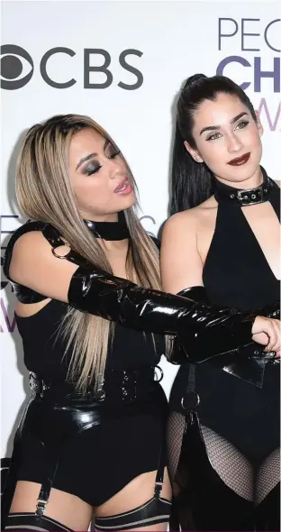  ?? Photograph: AP ?? Ally Brooke, from left, Lauren Jauregui, Dinah Jane, and Normani Hamilton of the musical group Fifth Harmony pose in the press room with the award for favorite group at the People's Choice Awards at the Microsoft Theater on Wednesda in Los Angeles