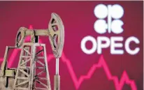  ?? DADO RUVIC • REUTERS ?? A 3-D printed oil pump jack is seen in front of displayed stock graph and OPEC logo in this illustrati­on —