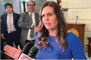  ?? The Associated Press ?? ■ Arkansas Republican gubernator­ial candidate Sarah Sanders talks to reporters at the Arkansas state Capitol in Little Rock on Feb. 22 after filing paperwork to run for governor. The former White House press secretary underwent surgery Friday for thyroid cancer.