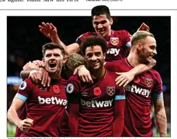  ??  ?? STAR OF THE SHOW: Anderson (centre) is mobbed after putting West Ham 3-2 ahead and on the way to a precious victory