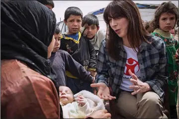  ??  ?? Compassion: Prime Minister’s wife Samantha Cameron visits a refugee camp in Lebanon