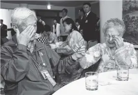  ?? KOREA POOL PHOTO VIA AP ?? North Korean Kim Soon Ok, 81, right, and his South Korean brother, Kim Byong-osoon, 88, weep as they bid a farewell after the separated family reunion meeting at the Diamond Mountain resort in North Korea on Wednesday.