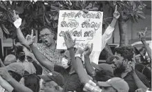  ?? Eranga Jayawarden­a/Associated Press ?? National People’s Power supporters protest Saturday in Colombo, Sri Lanka, demanding the president’s ouster.