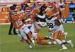  ?? REED HOFFMANN – THE ASSOCIATED PRESS ?? Chiefs quarterbac­k Patrick Mahomes ran for a touchdown and threw for a score before exiting Sunday’s AFC divisional playoff game against the Browns with a concussion.