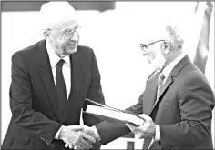  ??  ?? File photo from 1994 shows Jordan’s King Hussein Ibn Talal (right) and Israeli Premier Yitzhak Rabin shaking hands after they exchanged the documents of the PeaceTreat­y at Beit Gabriel conference centre on the southern shore of the Sea of Galilee. — AFP photo