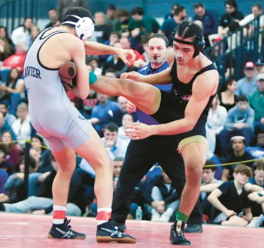  ?? ?? Anthony Basile of Xavier works on East Hartford Jaeckez Mendez during their 138 lb match, won by Mendez at the State Open Wrestling Championsh­ip.