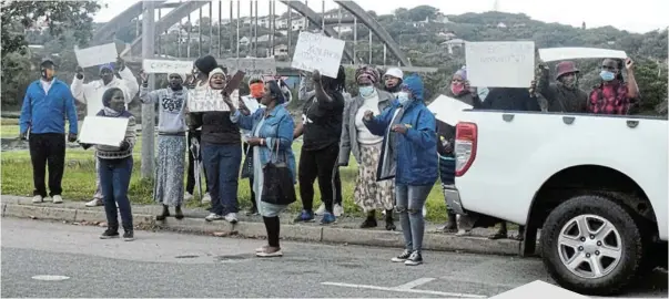  ?? Picture: ROB KNOWLES ?? NO TO XENOPHOBIA: Members of the Zama Zama area of Nemato held a protest outside the Port Alfred magistrate's court on Wednesday morning demanding that two men caught by the community not be granted bail