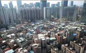  ?? RUAN CHUANJU / FOR CHINA DAILY ?? “Urban villages” provide migrant workers with low-cost housing in Shenzhen’s Futian subdistric­t.