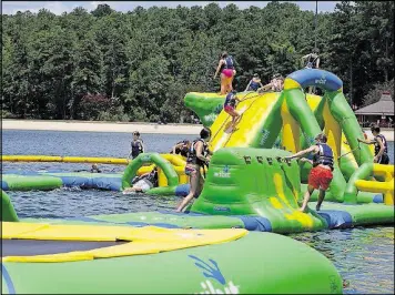  ?? CALLAWAY GARDENS ?? Aqua Island at Callaway Gardens will be a good way to cool off, even in (early) September.