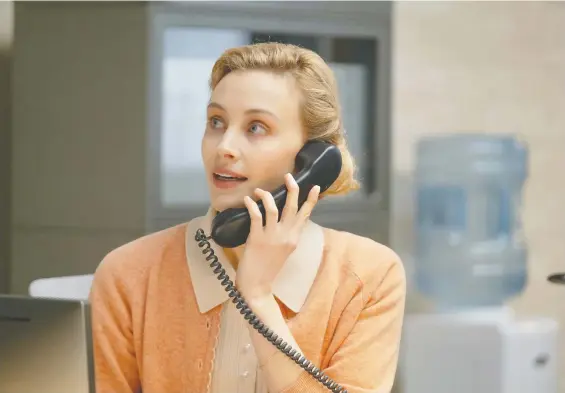  ?? OLIVER WHEELDON ?? Sarah Gadon plays receptioni­st Alyssa in the recently Vancouver-shot absurdist office comedy Corner Office. The film also stars Jon Hamm and Danny Pudi.