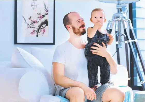  ?? Picture: SCOTT POWICK ?? Researcher­s are looking for first-time fathers like Oliver Cornally, with son George, 14 months, for a study into the effects of parenthood.