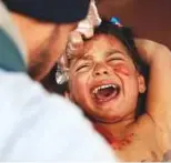  ?? AFP ?? Syrian boy Mohammad cries as he receives treatment at a makeshift hospital in Kafr Batna after being wounded with his mother in air strikes on the town of Jisreen, Eastern Ghouta, on Sunday.