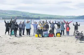  ??  ?? Team effort Staff, volunteers and children have a great time at the beach party