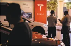  ?? Patrick T. Fallon / Bloomberg ?? On Wednesday, Tesla reported a quarterly loss, but said it is on track to become profitable in this year’s third and fourth quarters.