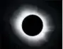  ?? STAN HONDA/GETTY-AFP ?? During a total solar eclipse, the sun’s rarely visible corona can be seen shining like a white crown around the blocked sun.