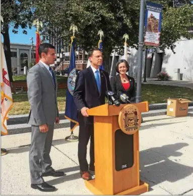  ?? KAITLYN FOTI — DIGITAL FIRST MEDIA ?? Montgomery County Commission­ers Joe Gale, Josh Shapiro and Val Arkoosh speak Tuesday at a ceremony in Norristown honoring the families of Montgomery County men who died in military service.