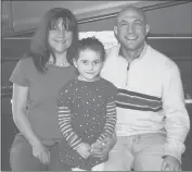  ?? AP 2012 ?? This photo provided by the family shows Avielle Richman, center, with her parents, Jennifer Hensel and Jeremy Richman, in Boston. Avielle was among the 20 children killed in the Dec. 14, 2012, Sandy Hook Elementary School shooting.